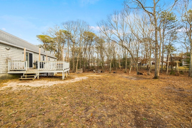 view of yard with a wooden deck