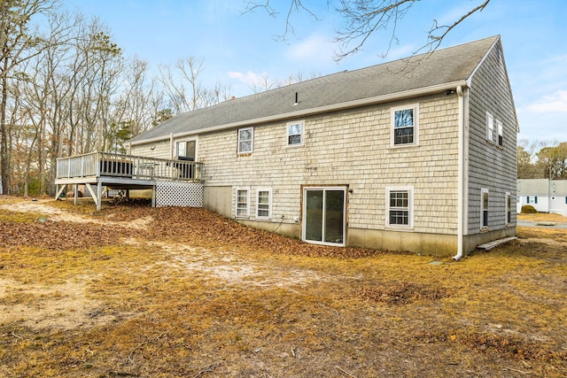 back of property featuring a deck