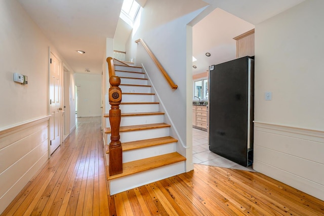 40 Thacher Shore Rd, Yarmouth Port, MA 02675 - stairs featuring hardwood / wood-style flooring and a wainscoted wall