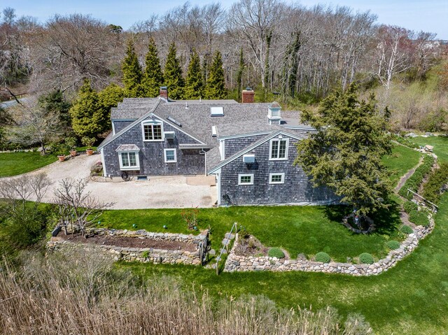 40 Thacher Shore Rd, Yarmouth Port, MA 02675 - rear view of house featuring a lawn and a chimney