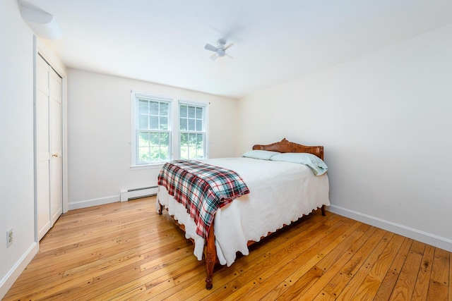 40 Thacher Shore Rd, Yarmouth Port, MA 02675 - bedroom with a baseboard radiator, light wood-style floors, and baseboards