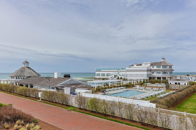 view of pool featuring a water view