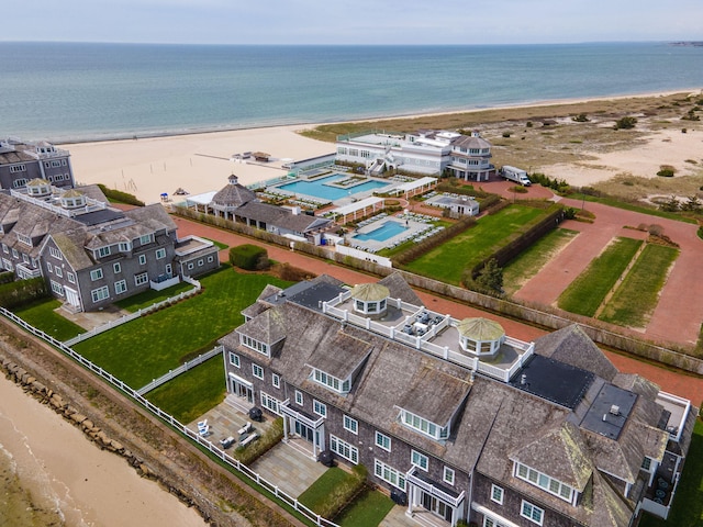aerial view of a pool area and expansive coastline