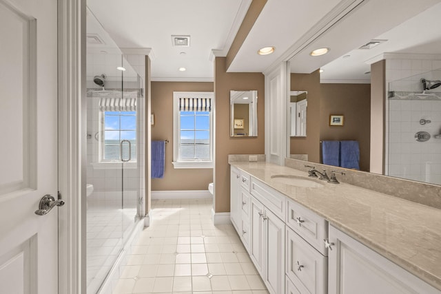 full bathroom featuring crown molding, baseboards, toilet, a stall shower, and vanity