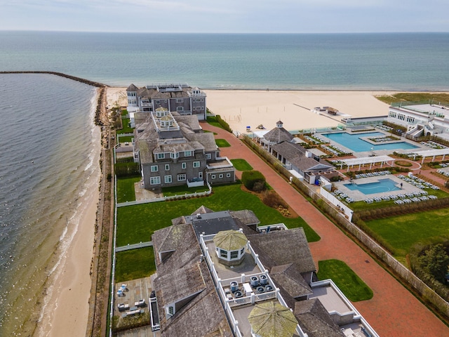 bird's eye view of expansive beach and a pool