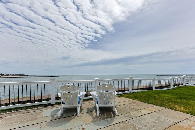 view of patio featuring a water view