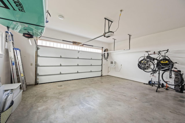 garage featuring a garage door opener