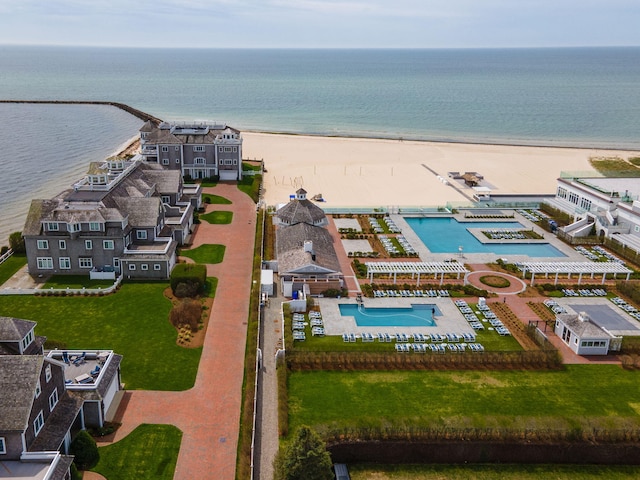 bird's eye view of a pool area and expansive beach