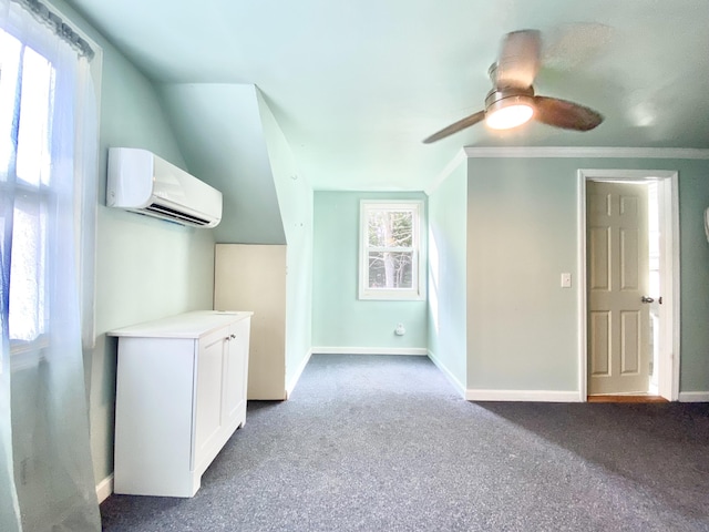 interior space with ceiling fan, a wealth of natural light, carpet flooring, and a wall mounted air conditioner