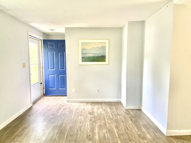 empty room with light hardwood / wood-style floors