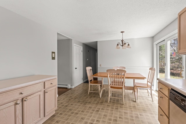 dining area with an inviting chandelier, a textured ceiling, and baseboard heating
