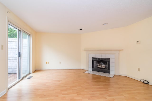 17 Harbor Hill Dr, Bourne, MA 02532 - unfurnished living room with light wood finished floors, a fireplace, and recessed lighting