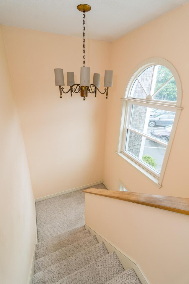 17 Harbor Hill Dr, Bourne, MA 02532 - staircase featuring a chandelier and carpet floors