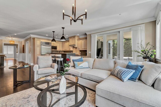 66 Simons Rd Unit A, Mashpee, MA 02649 - living area with crown molding, recessed lighting, a chandelier, wood finished floors, and french doors