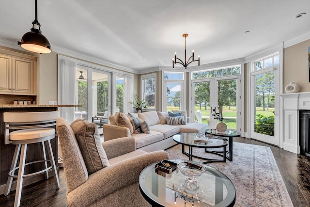 66 Simons Rd Unit A, Mashpee, MA 02649 - living room with french doors, crown molding, dark wood-style floors, and a chandelier