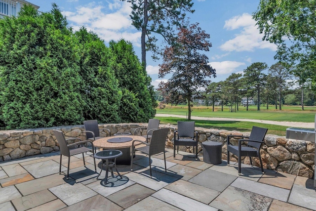 66 Simons Rd Unit A, Mashpee, MA 02649 - view of patio / terrace with a fire pit