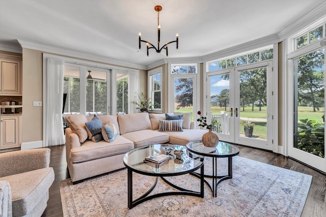 66 Simons Rd Unit A, Mashpee, MA 02649 - living room featuring french doors, plenty of natural light, crown molding, a chandelier, and wood finished floors
