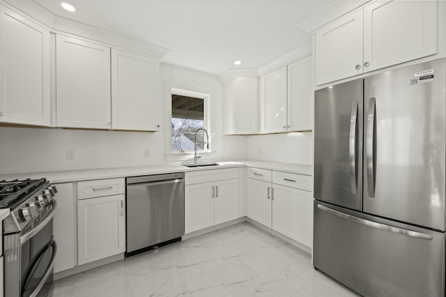 kitchen featuring sink, white cabinetry, and appliances with stainless steel finishes