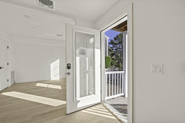 doorway to outside featuring light hardwood / wood-style floors