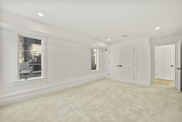 carpeted empty room featuring a healthy amount of sunlight