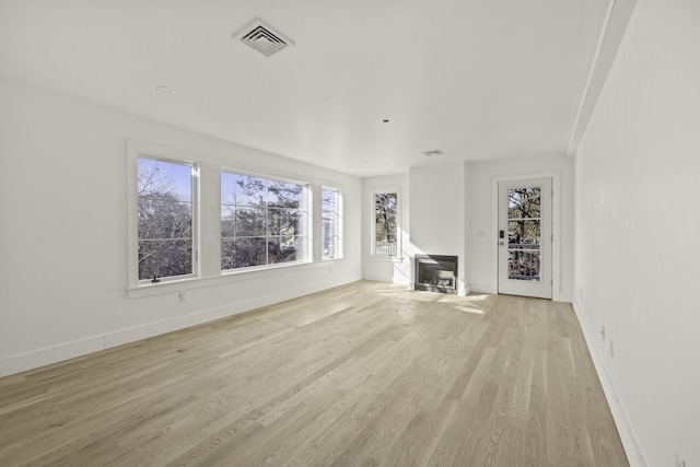 unfurnished living room featuring light hardwood / wood-style floors