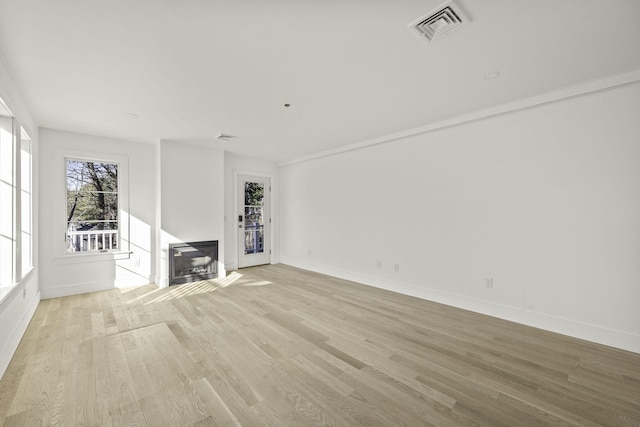 unfurnished living room with light hardwood / wood-style floors