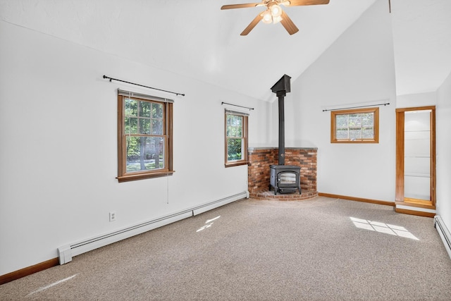 153 Blackthorn Rd, Marstons Mills, MA 02648 - unfurnished living room with a baseboard radiator, carpet flooring, a wood stove, a ceiling fan, and high vaulted ceiling