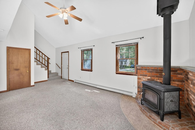 153 Blackthorn Rd, Marstons Mills, MA 02648 - unfurnished living room with a baseboard heating unit, a wood stove, ceiling fan, carpet floors, and stairway