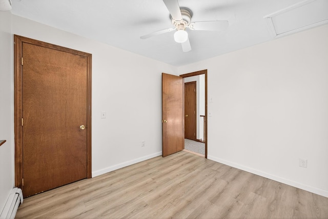 153 Blackthorn Rd, Marstons Mills, MA 02648 - unfurnished bedroom with baseboard heating, light wood-style floors, and a ceiling fan