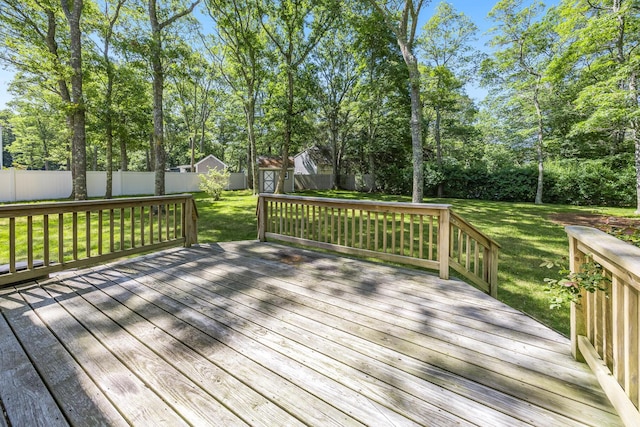 153 Blackthorn Rd, Marstons Mills, MA 02648 - wooden terrace with a fenced backyard, view of wooded area, and an outdoor structure