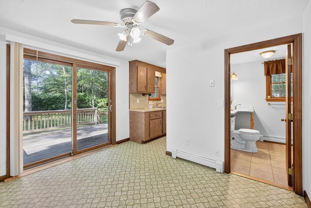 153 Blackthorn Rd, Marstons Mills, MA 02648 - kitchen with baseboard heating, plenty of natural light, and light countertops