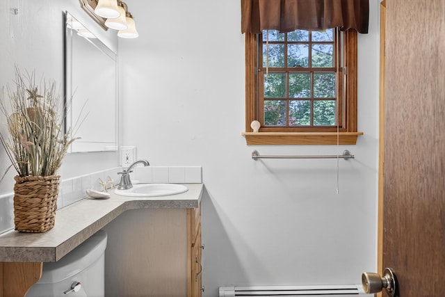 153 Blackthorn Rd, Marstons Mills, MA 02648 - half bathroom featuring a baseboard radiator and vanity