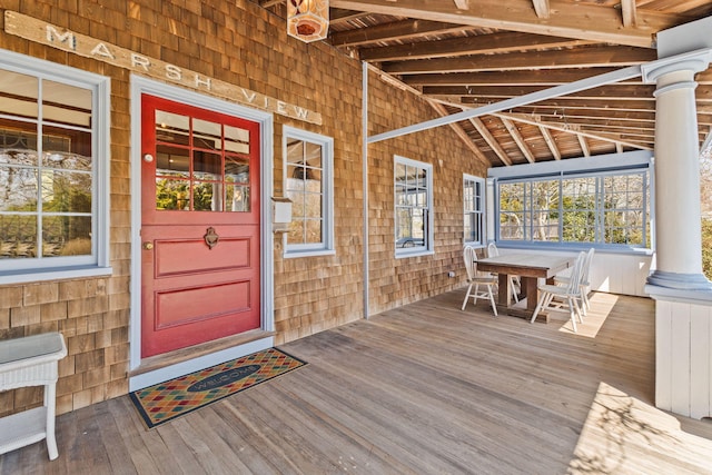 entrance to property featuring outdoor dining area