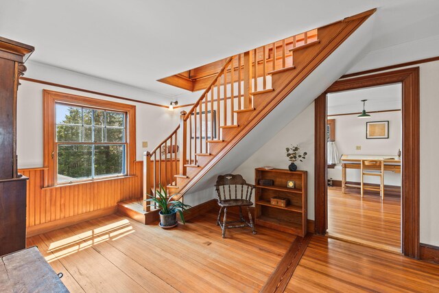 10 Quissett Ave, Woods Hole, MA 02543 - staircase featuring hardwood / wood-style flooring, wainscoting, and ornamental molding