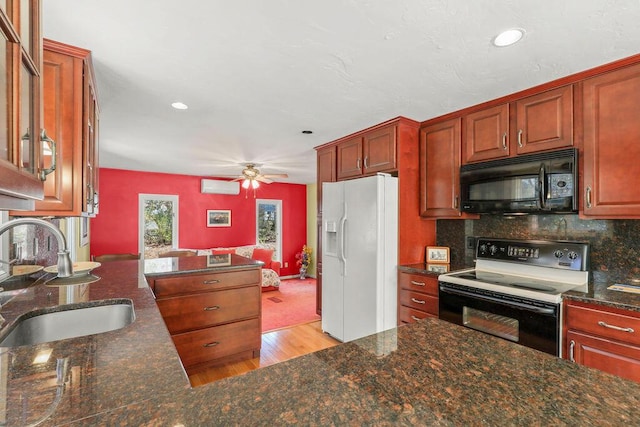 kitchen with black appliances, tasteful backsplash, sink, light wood-type flooring, and ceiling fan