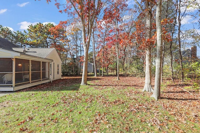 view of yard with a sunroom