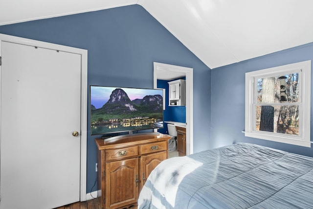 bedroom featuring hardwood / wood-style flooring and vaulted ceiling