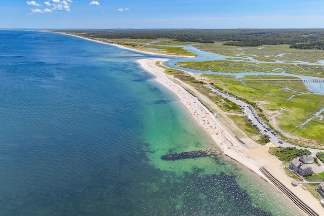 birds eye view of property with a beach view and a water view