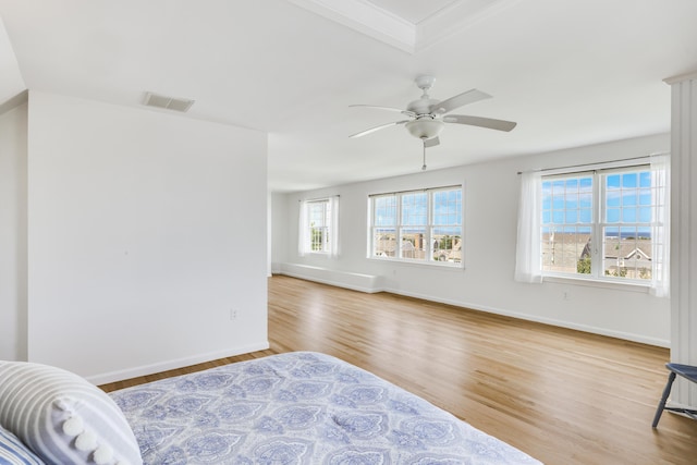 bedroom with ceiling fan and light hardwood / wood-style floors