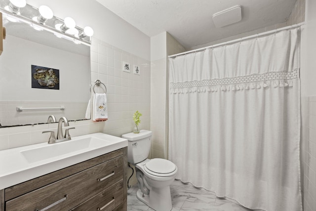 bathroom featuring vanity, toilet, tile walls, and a shower with curtain