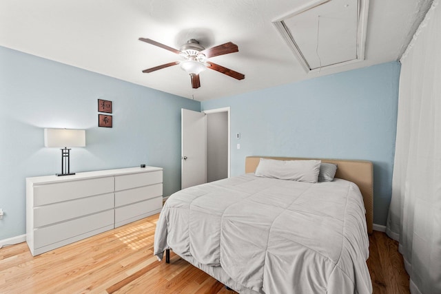 bedroom featuring ceiling fan and hardwood / wood-style flooring