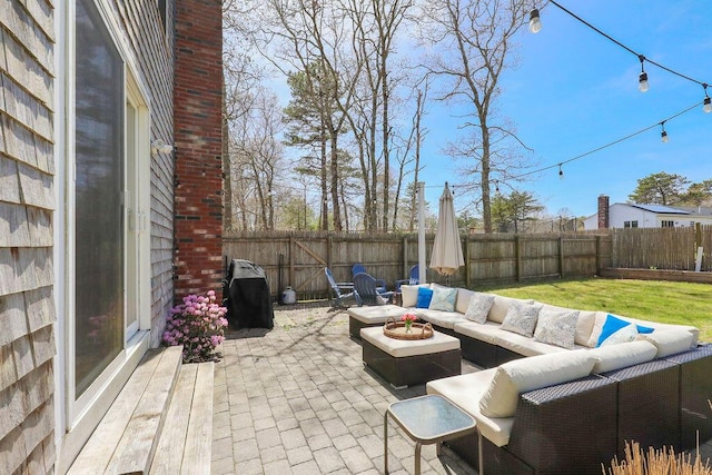 view of patio / terrace featuring outdoor lounge area and a fenced backyard