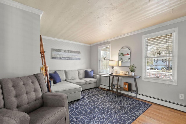 living room with crown molding and wood finished floors