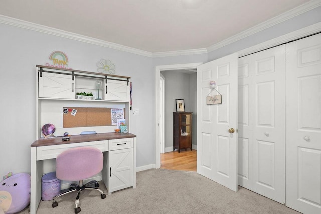 office space featuring crown molding, baseboards, and light carpet
