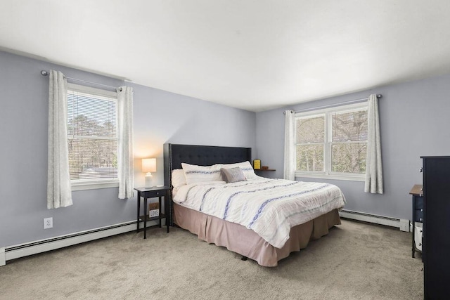 carpeted bedroom featuring a baseboard radiator