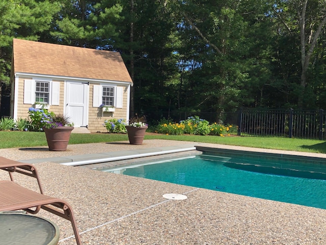 view of pool with an outdoor structure