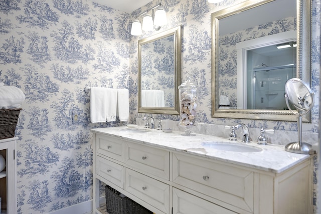 bathroom featuring vanity and a shower with shower door