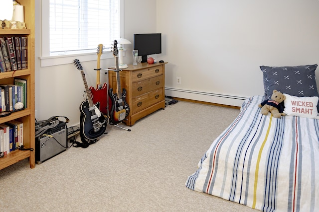 carpeted bedroom with a baseboard heating unit