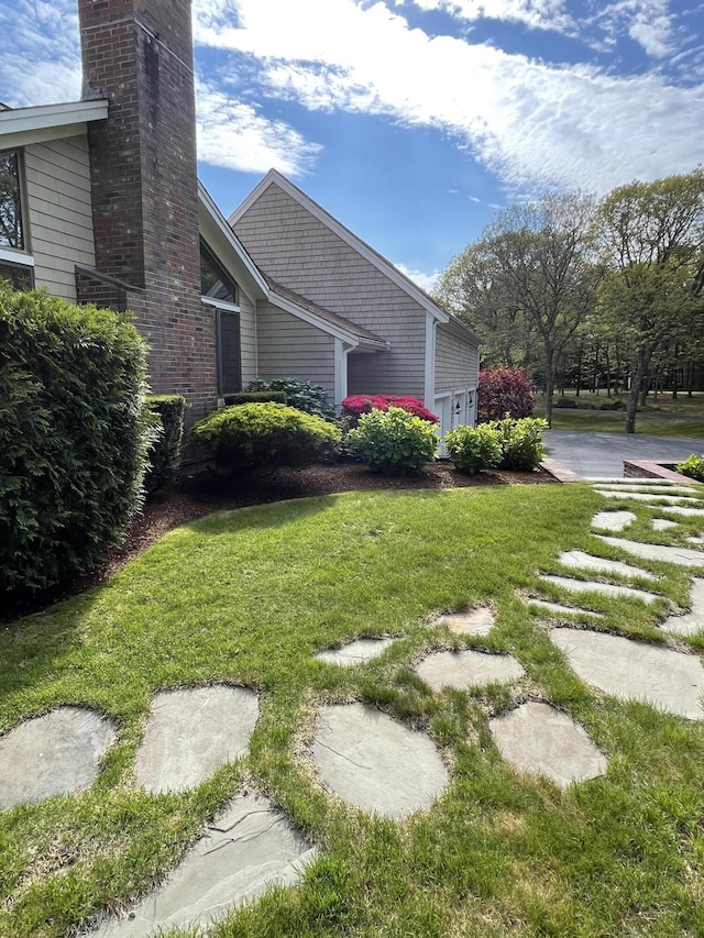 view of home's exterior featuring a yard