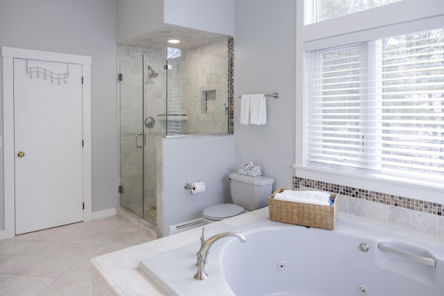 bathroom with tile patterned flooring, plenty of natural light, plus walk in shower, and toilet